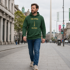 Man wearing the Dublin Spire forest green hoodie on O'Connell Street