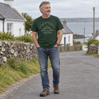Man wearing Mayo Croagh Patrick forest green T-shirt in a local setting